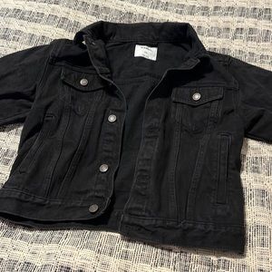 Black jeans jacket. Never worn size 8 reality could fit a xs in adults/short arm